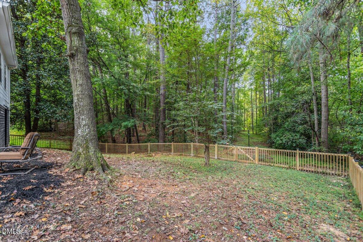 1007 Castalia Drive Cary, NC 27513 - Photo 2 of 30 a backyard of a house with lots of green space