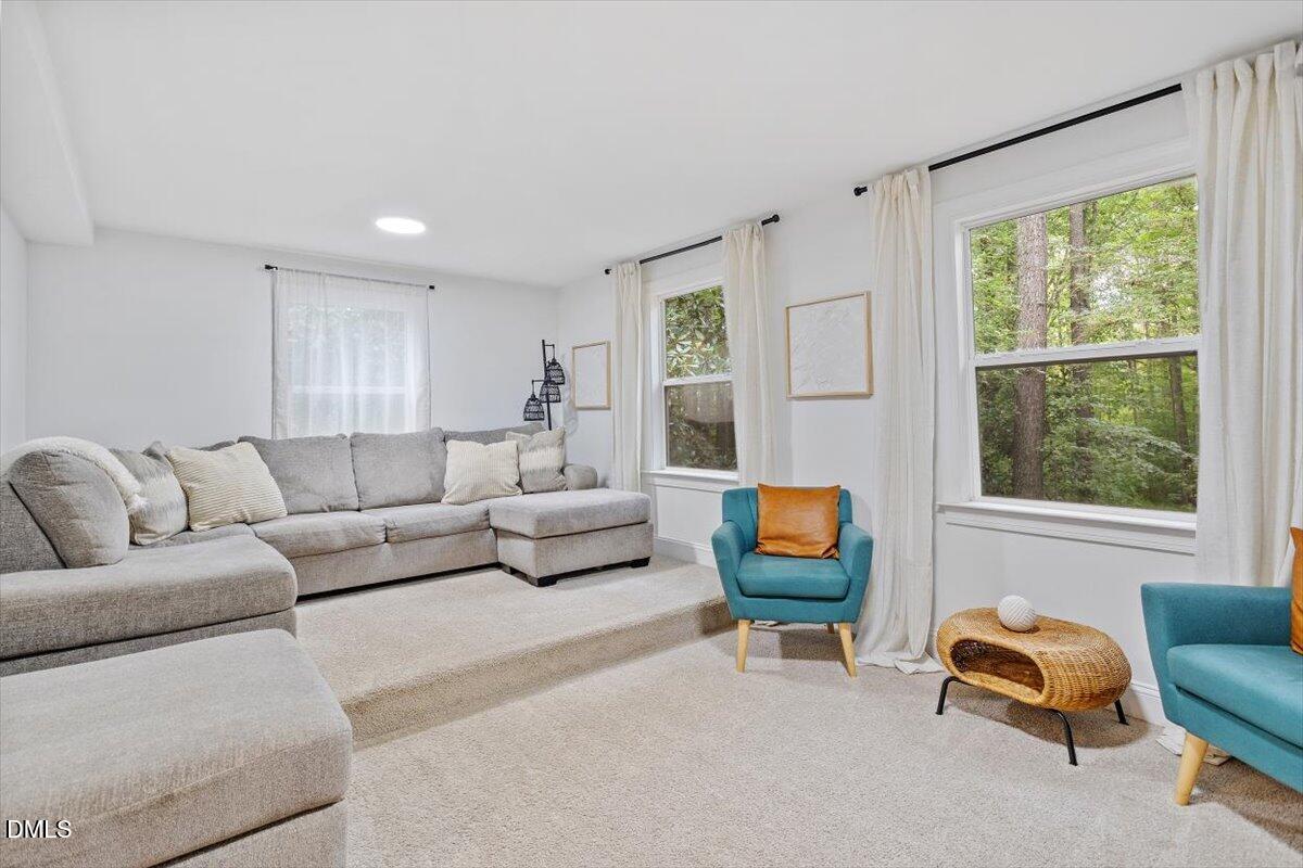 1007 Castalia Drive Cary, NC 27513 - Photo 21 of 30 a living room with furniture and a window