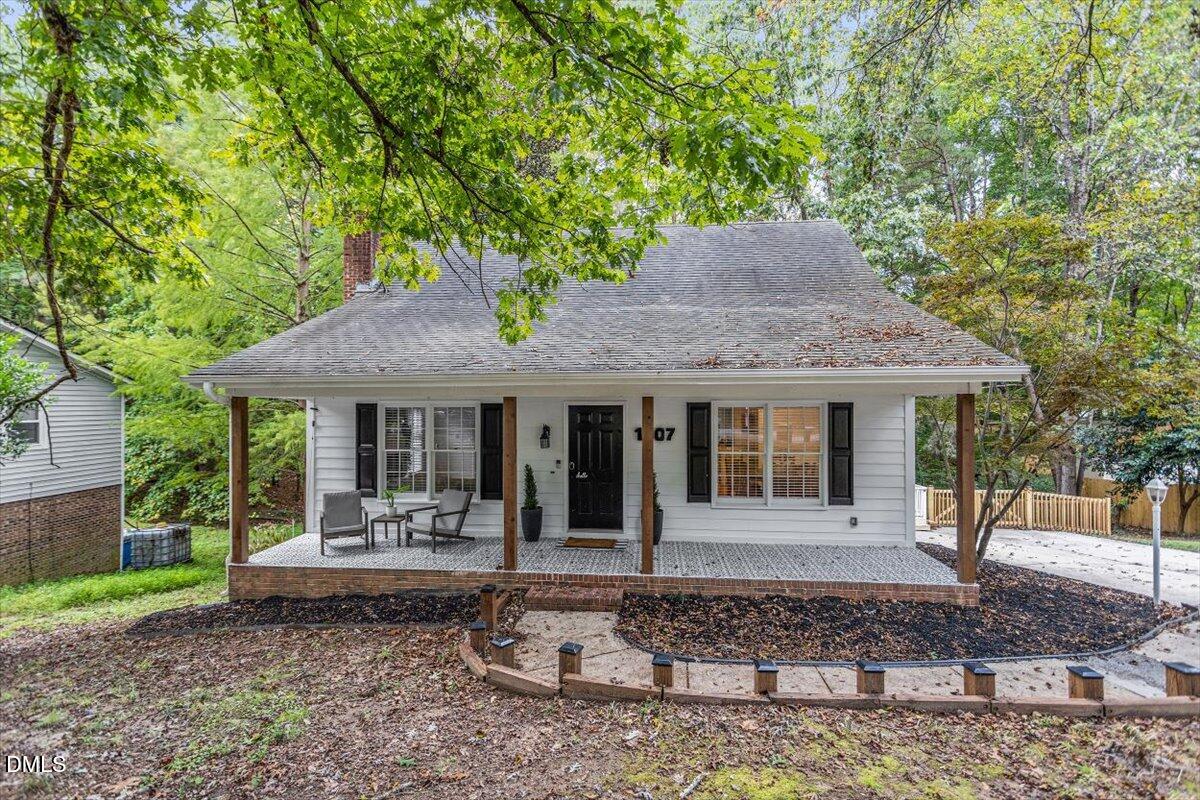 1007 Castalia Drive Cary, NC 27513 - Photo 3 of 30 a front view of a house with garden