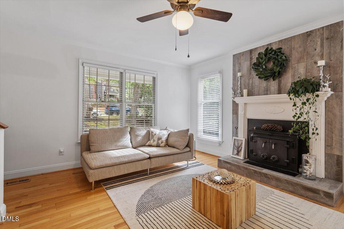 1007 Castalia Drive Cary, NC 27513 - Photo 6 of 30 a living room with furniture and a fireplace