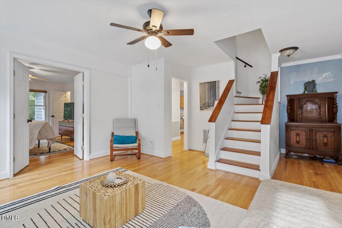 1007 Castalia Drive Cary, NC 27513 - Photo 7 of 30 a living room with furniture and a wooden floor