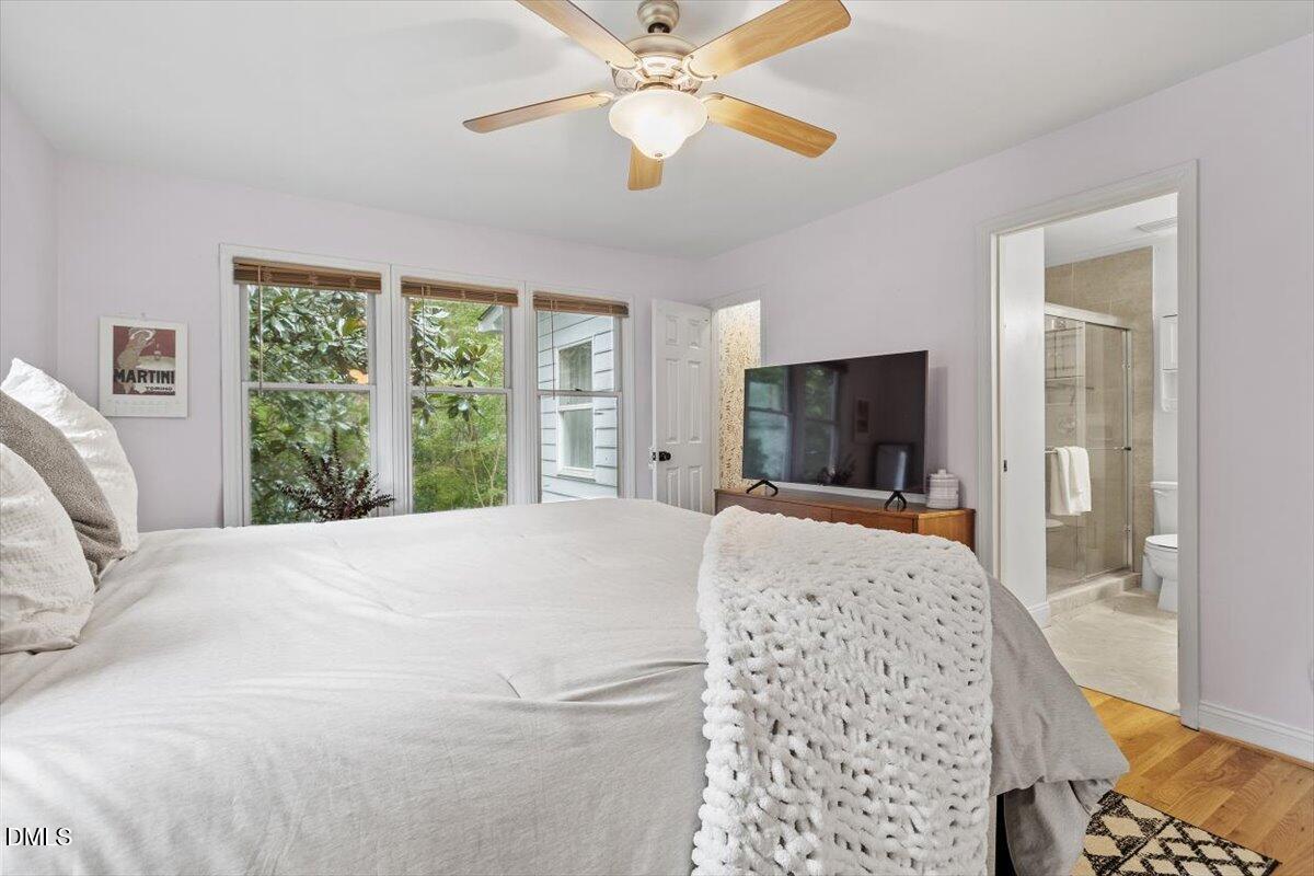 1007 Castalia Drive Cary, NC 27513 - Photo 9 of 30 a bedroom with a large bed and a window