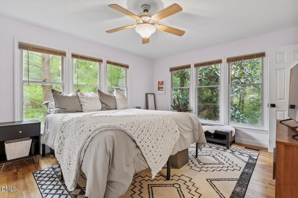 1007 Castalia Drive Cary, NC 27513 - Photo 10 of 30 a bed sitting in a bedroom next to a window