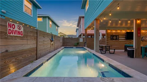 a view of the house with a swimming pool