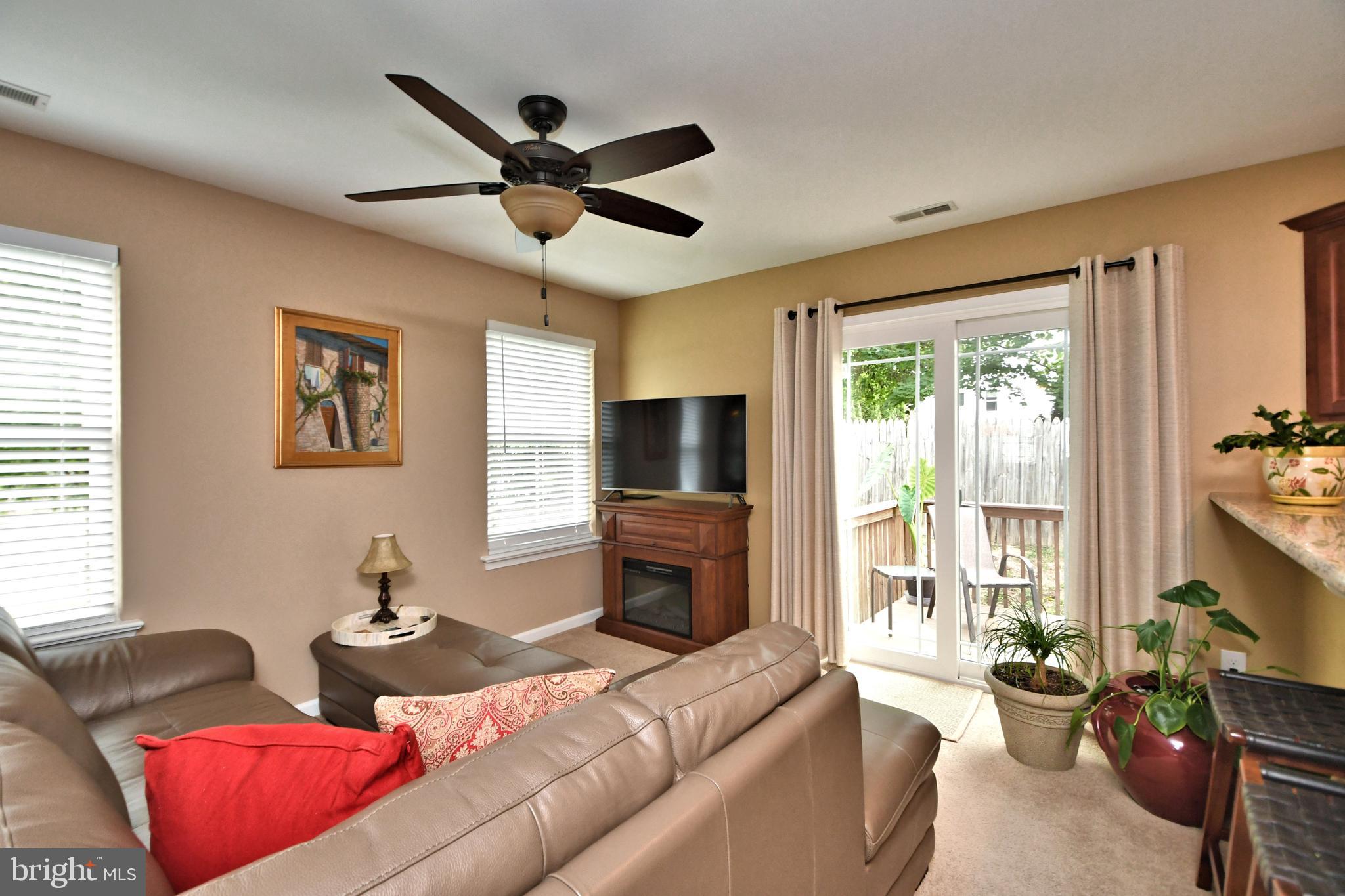 400 North York Road, Unit A Hatboro, PA 19040 - Photo 6 of 24 Family room with ceiling fan & access to deck.