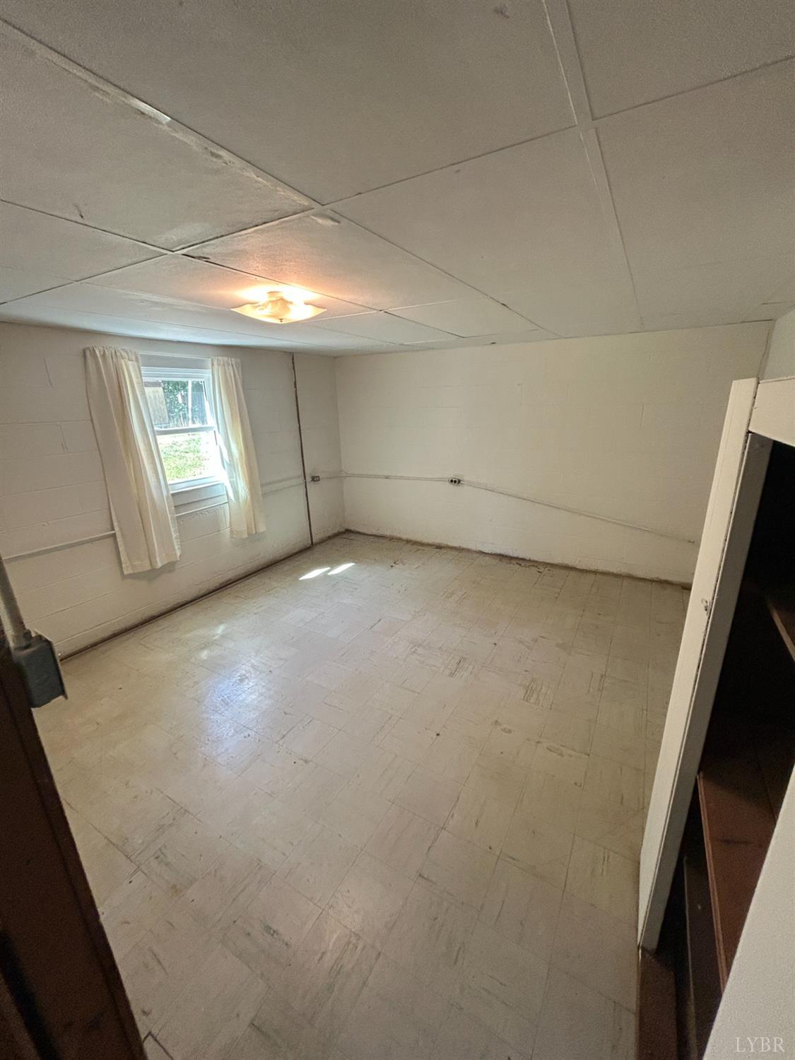 465 Wileman Road Lynch Station, VA 24571 - Photo 28 of 45 a view of a livingroom with an empty space and a window