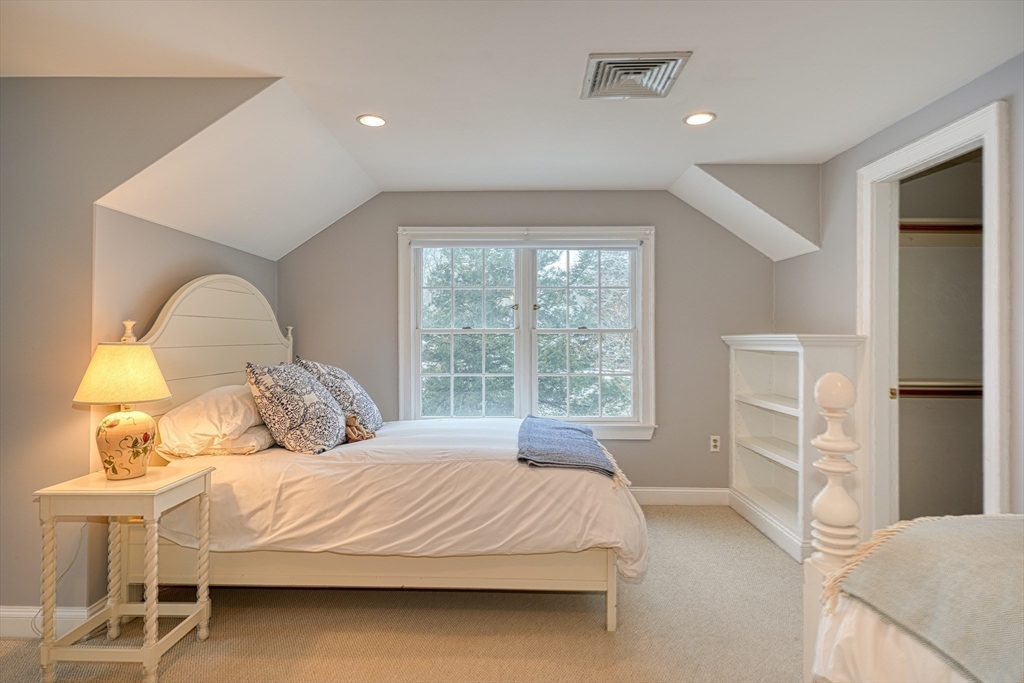 191 Claybrook Road Dover, MA 02030 - Photo 19 of 34 a bedroom with a bed and a table