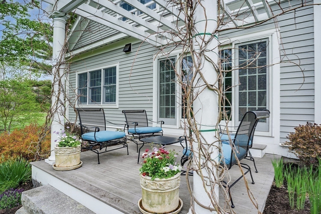191 Claybrook Road Dover, MA 02030 - Photo 28 of 34 a view of outdoor sitting area with furniture and wooden floor