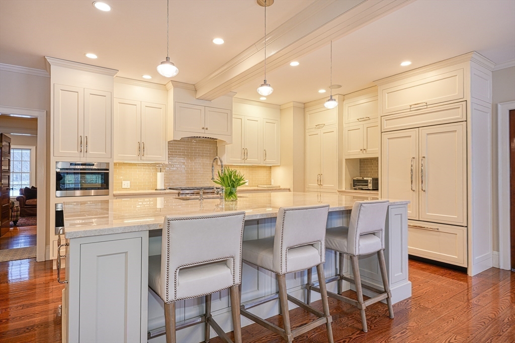 191 Claybrook Road Dover, MA 02030 - Photo 5 of 34 a kitchen with kitchen island granite countertop wooden cabinets and center island