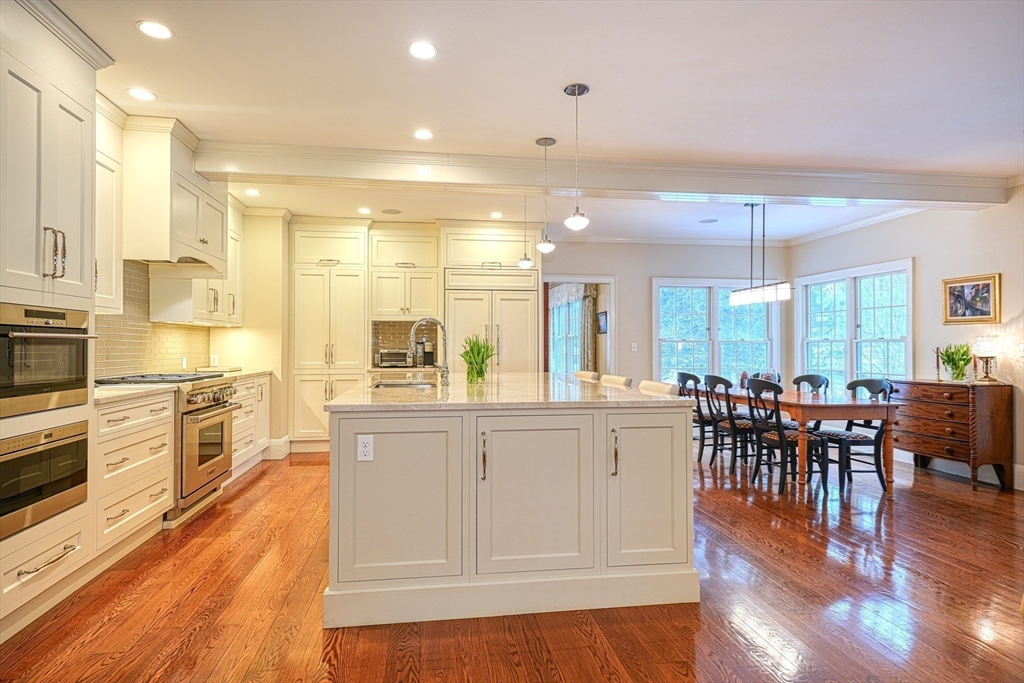 191 Claybrook Road Dover, MA 02030 - Photo 6 of 34 a large white kitchen with lots of counter space and stainless steel appliances