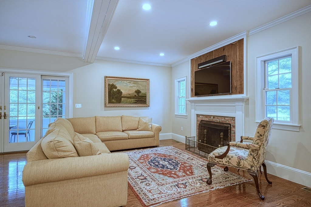 191 Claybrook Road Dover, MA 02030 - Photo 8 of 34 a living room with furniture or fireplace and a flat screen tv
