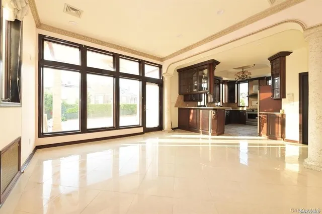 a kitchen with a counter space a sink appliances and cabinets
