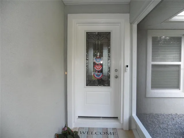 a view of an empty room and a window