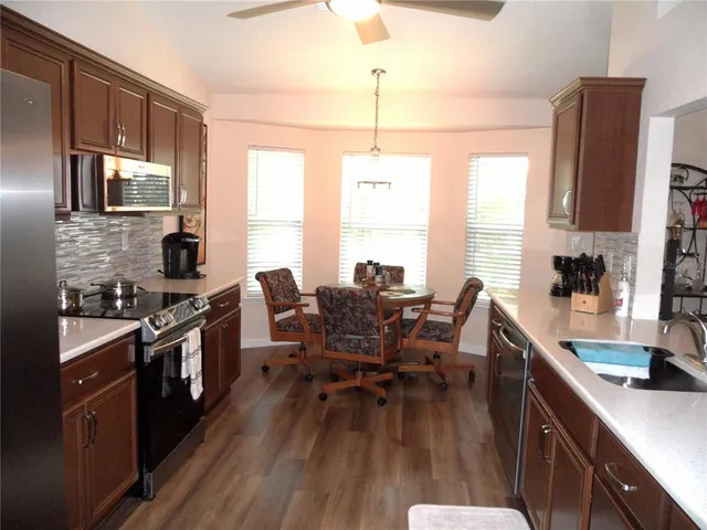a kitchen with a stove and a microwave