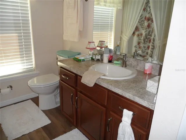 a bathroom with a sink and a window