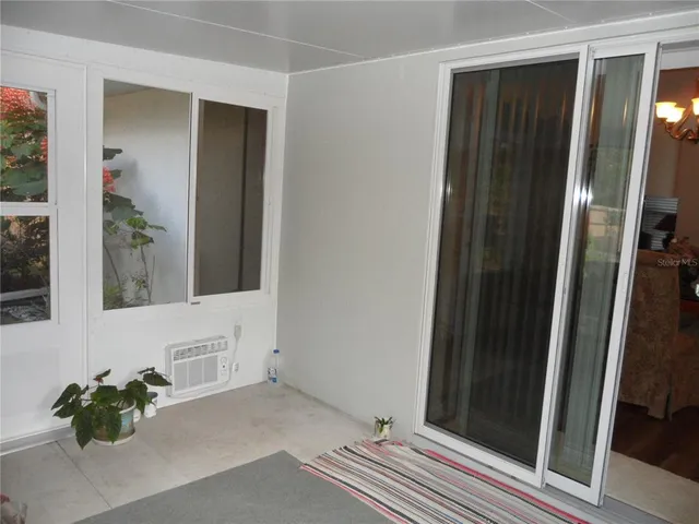 a room with furniture and a flat screen tv