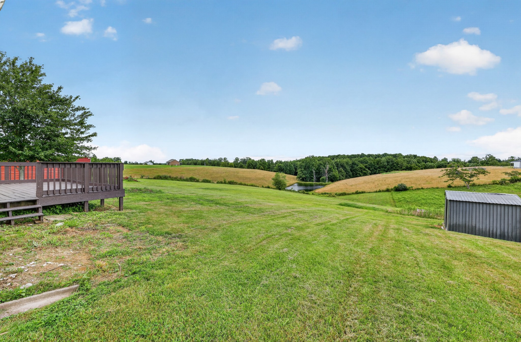 120 Driver Road Lafayette, TN 37083 - Photo 30 of 39 a yard with lots of green space and palm trees