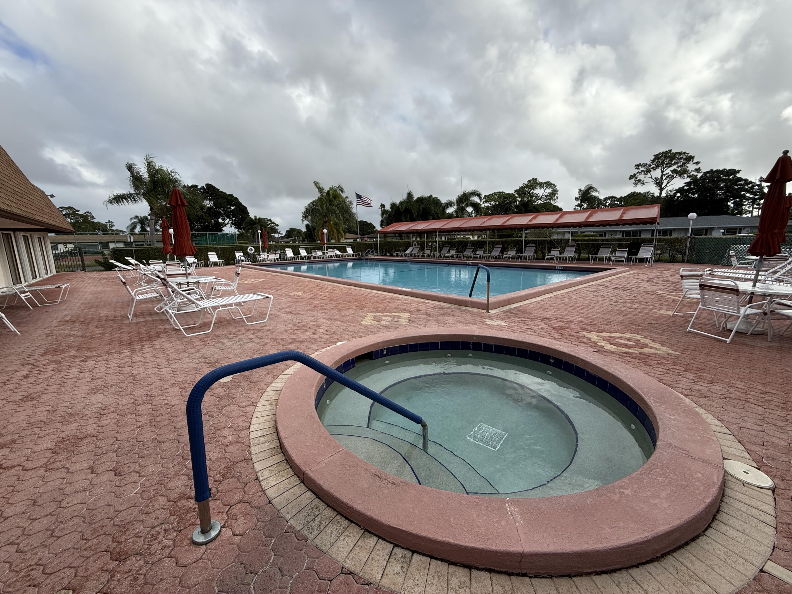5139 Poppy Place, Unit A Delray Beach, FL 33484 - Photo 13 of 36 a view of swimming pool from a outdoor space