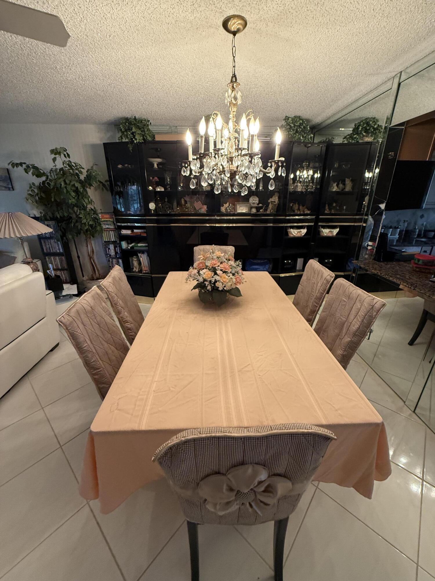5139 Poppy Place, Unit A Delray Beach, FL 33484 - Photo 25 of 36 a view of a dining room with furniture