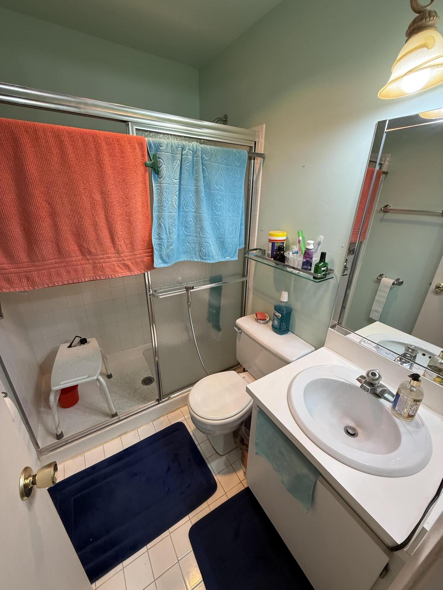 5139 Poppy Place, Unit A Delray Beach, FL 33484 - Photo 31 of 36 a bathroom with a sink and a toilet