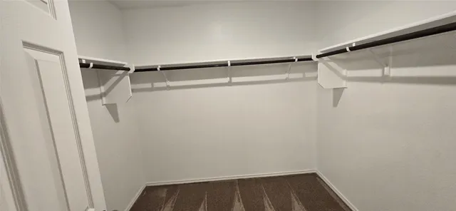 a view of a room with window and cabinet