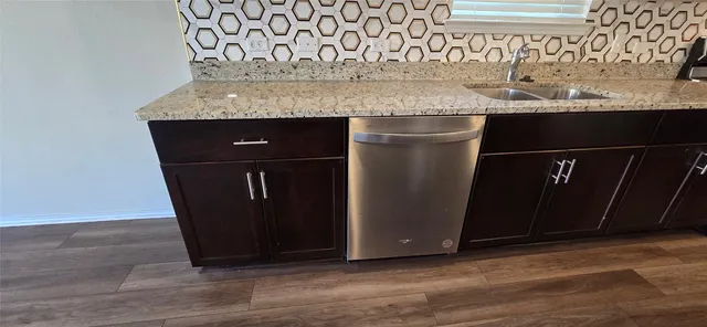 a kitchen with a sink and cabinets
