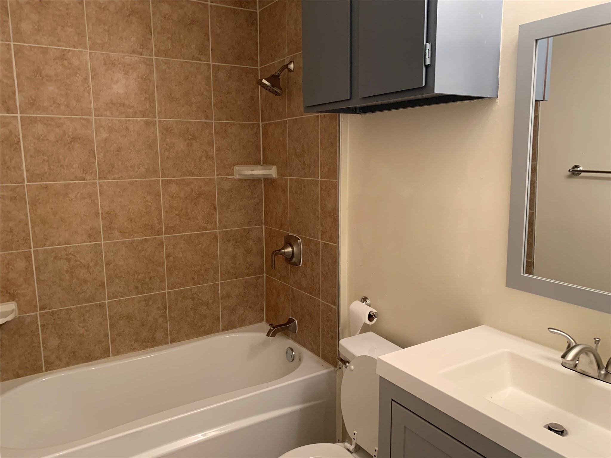 10447 Doc Holliday Trail, Unit B Austin, TX 78753 - Photo 11 of 19 Full bathroom with vanity and bathing tub / shower combination