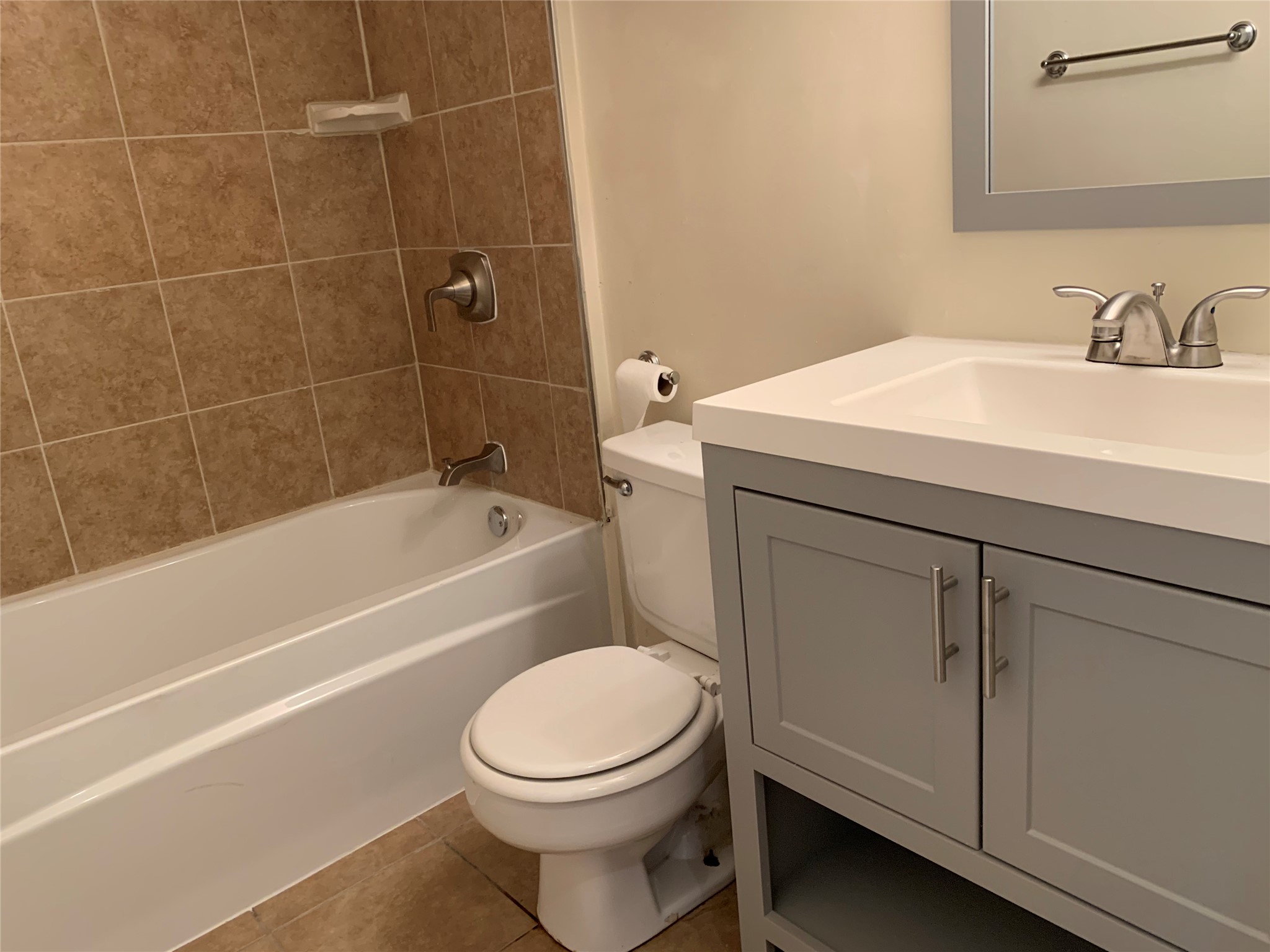 10447 Doc Holliday Trail, Unit B Austin, TX 78753 - Photo 14 of 19 Full bathroom with vanity, tub / shower combination, and light tile patterned floors