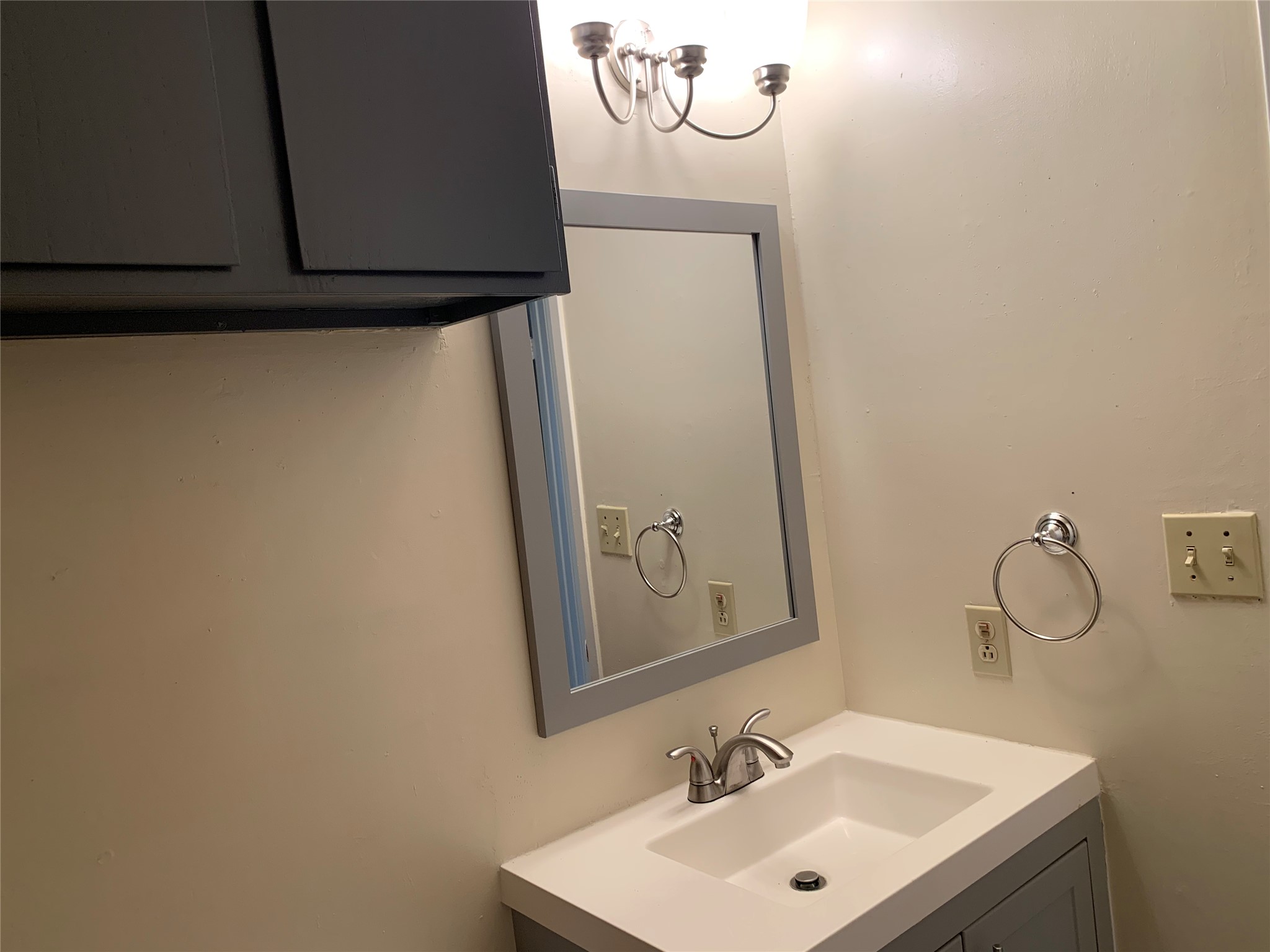 10447 Doc Holliday Trail, Unit B Austin, TX 78753 - Photo 17 of 19 Bathroom featuring vanity and a chandelier