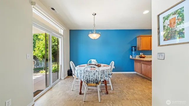 a dining room with furniture and window