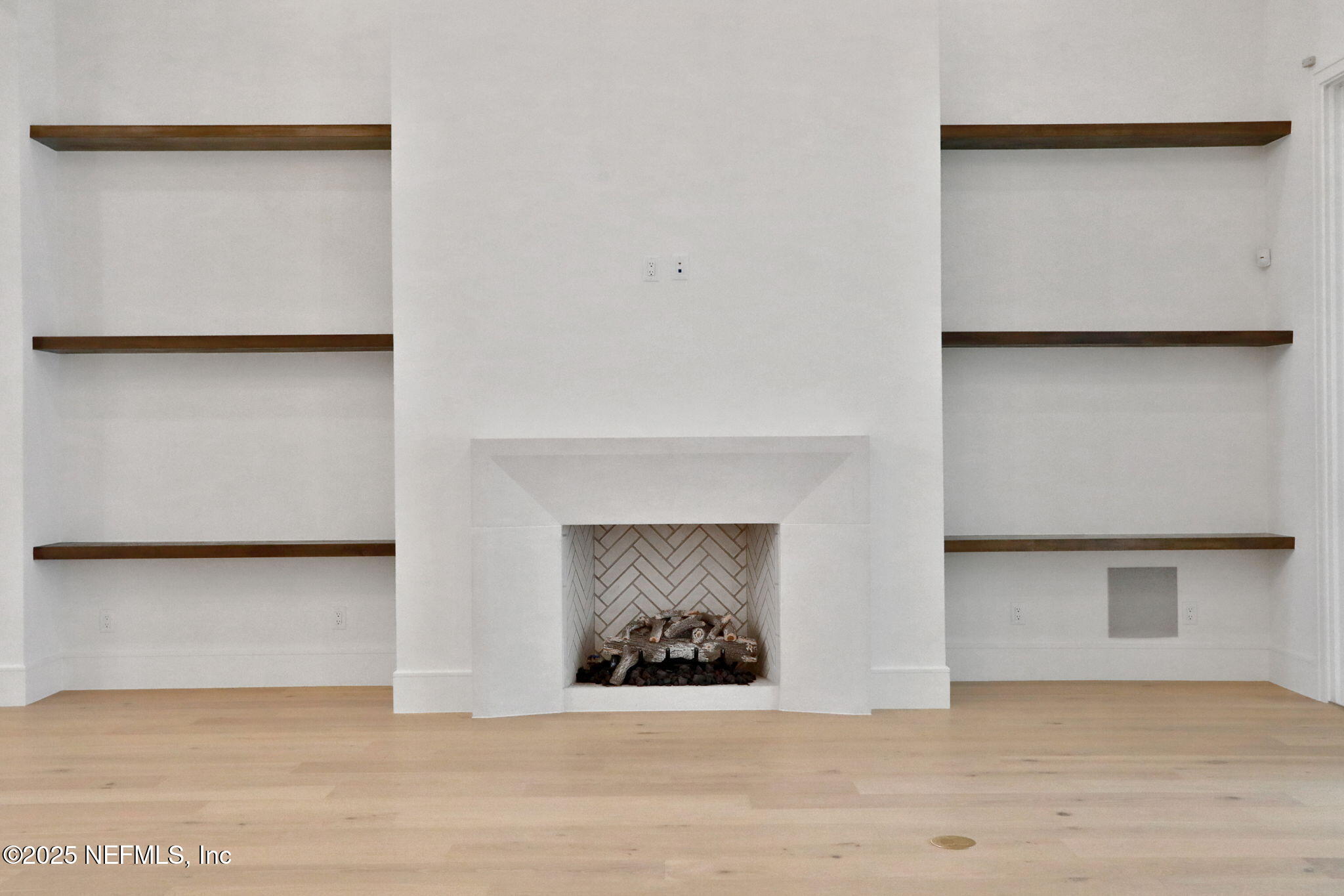 1789 North Loop Parkway St. Augustine, FL 32095 - Photo 29 of 62 a view of an empty room with wooden floor and a fireplace