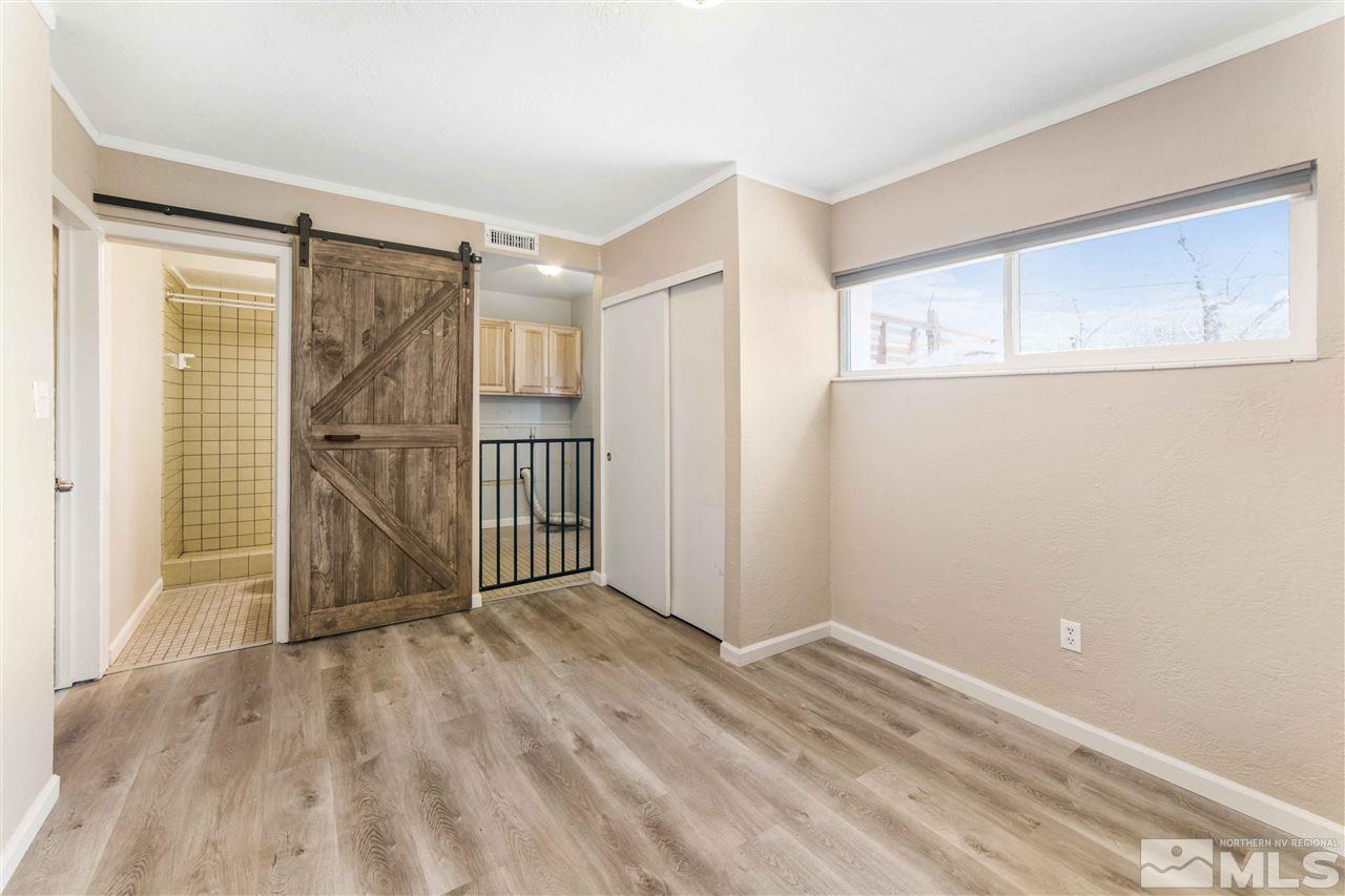 3370 Sandra Drive Reno, NV 89503 - Photo 32 of 40 a view of empty room with wooden floor and fan
