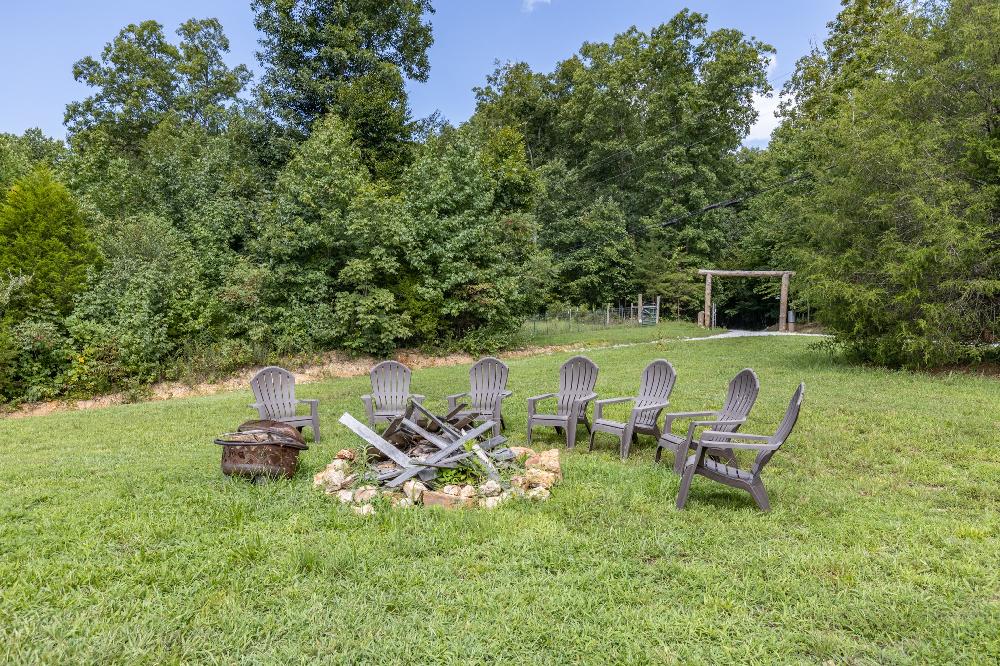 609 Waterloo Road Westpoint, TN 38486 - Photo 56 of 70 a backyard of a house with table and chairs