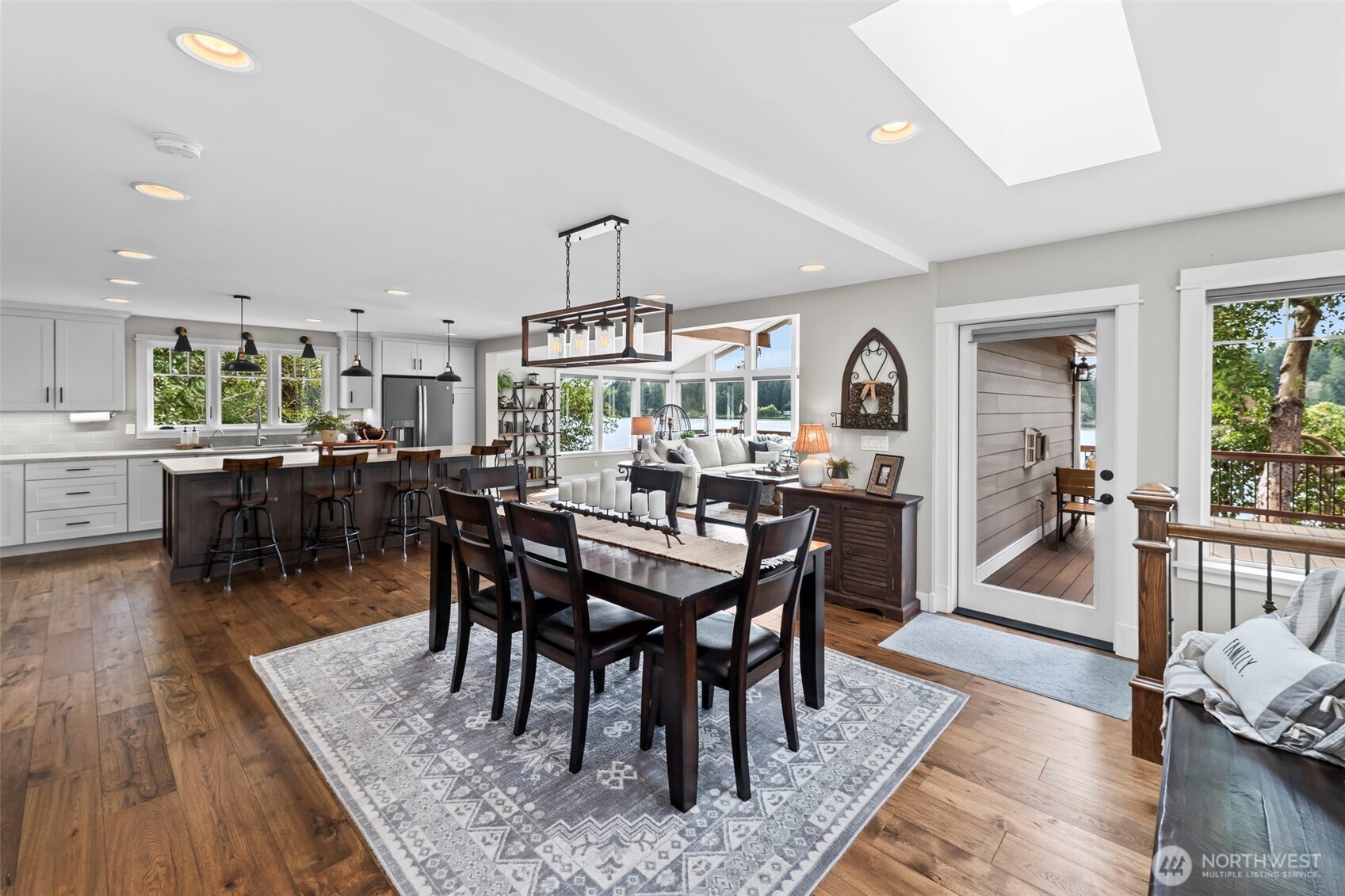 6501 27th Lane Southeast Lacey, WA 98503 - Photo 13 of 40 a view of a dining room with furniture and wooden floor
