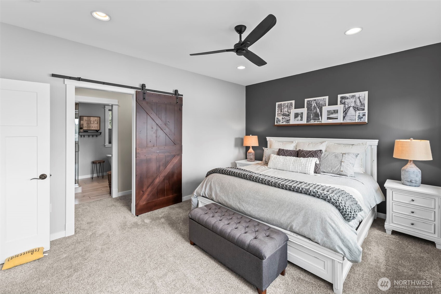 6501 27th Lane Southeast Lacey, WA 98503 - Photo 23 of 40 a spacious bedroom with a bed and a walk in closet