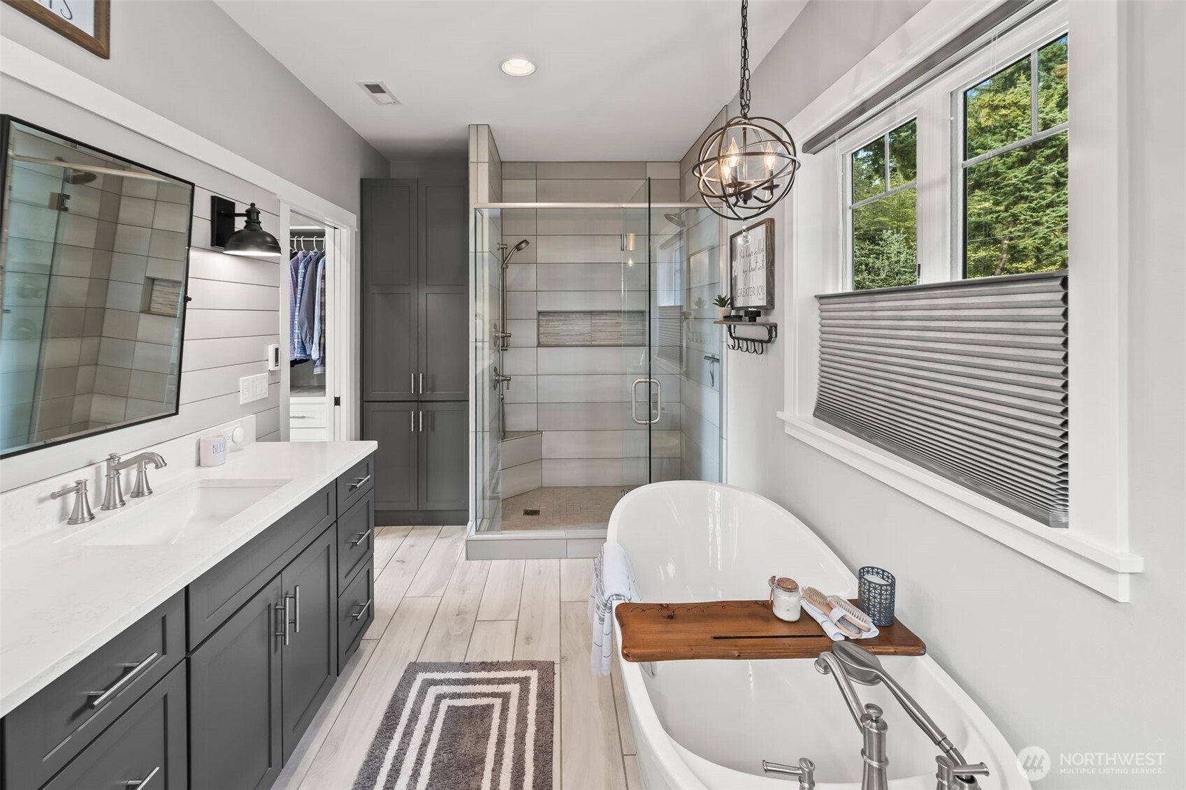 6501 27th Lane Southeast Lacey, WA 98503 - Photo 25 of 40 a bathroom with a sink a toilet a mirror and shower