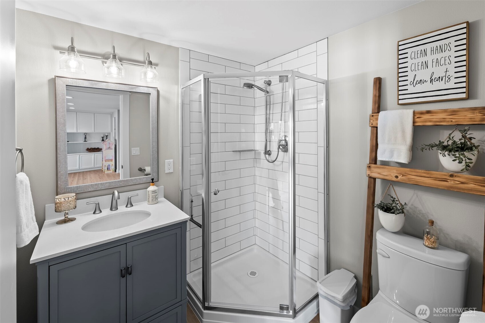 6501 27th Lane Southeast Lacey, WA 98503 - Photo 29 of 40 a bathroom with a shower sink and mirror