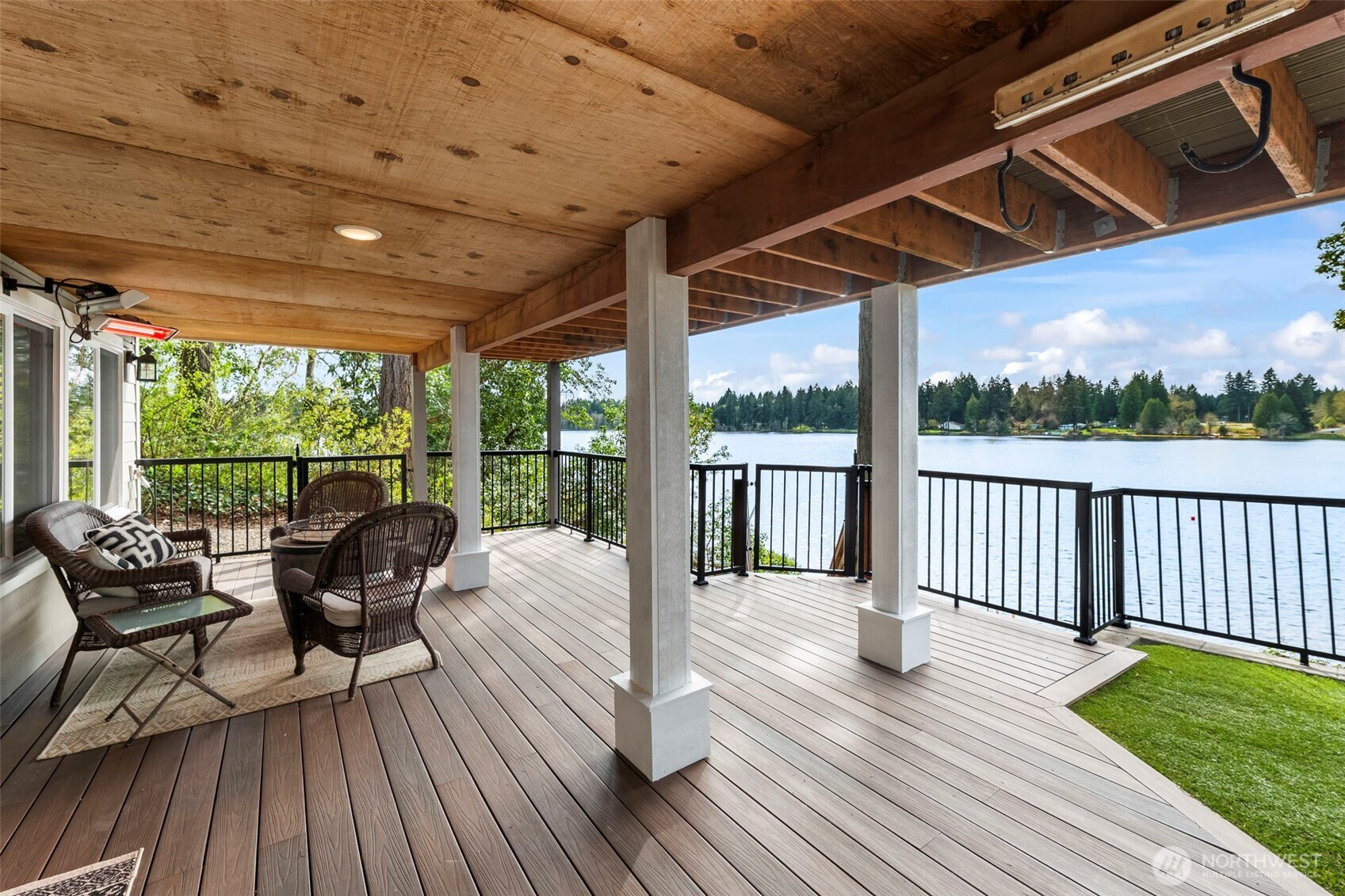 6501 27th Lane Southeast Lacey, WA 98503 - Photo 33 of 40 a view of a patio with wooden floor chairs and wooden floor