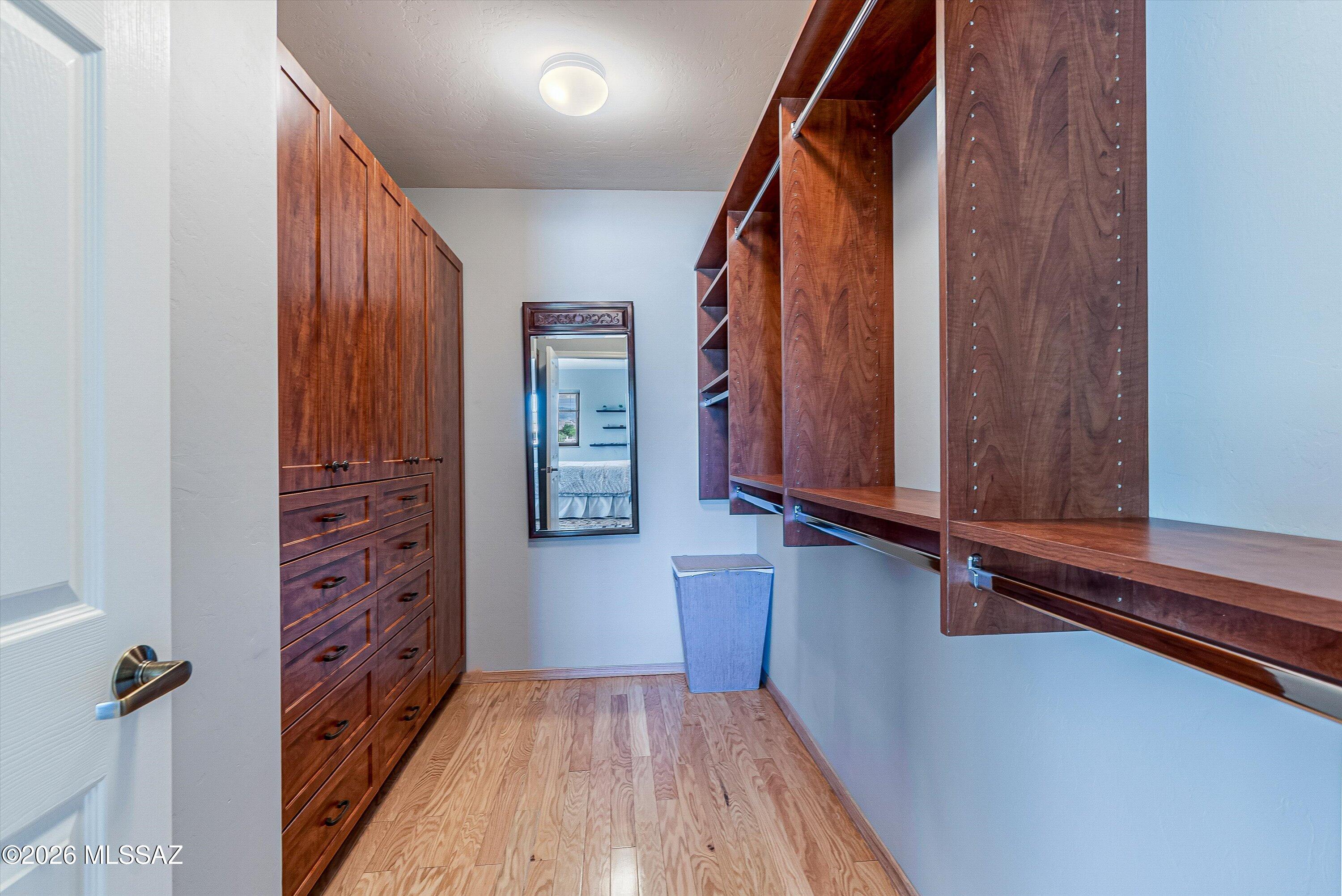 100 North Eastern Slope Loop Tucson, AZ 85748 - Photo 19 of 37 The spacious Walk-in Primary closet has been outfitted with a custom closet system.