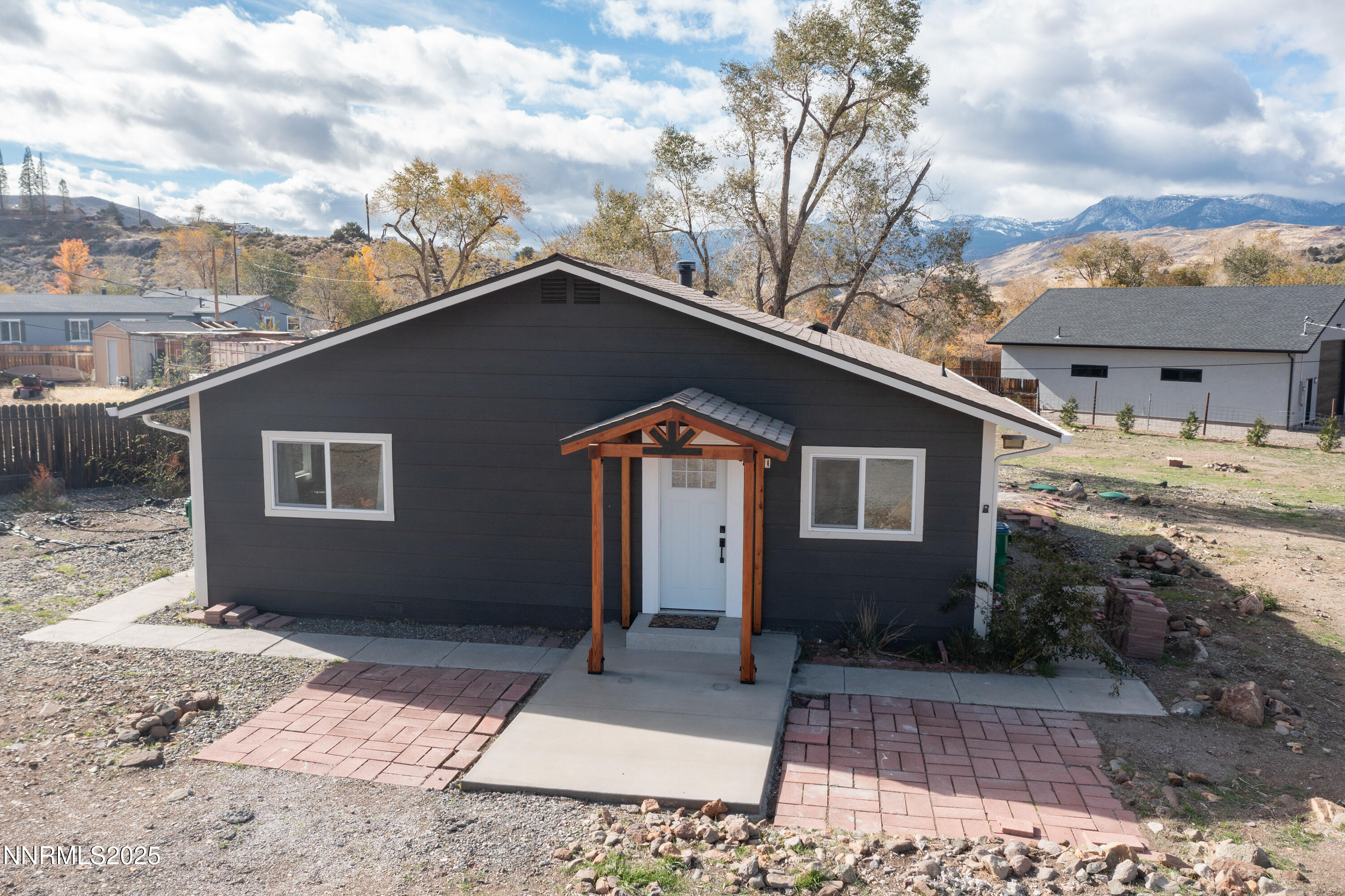 15725 Toll Road Reno, NV 89521 - Photo 1 of 27 a front view of a house with a yard