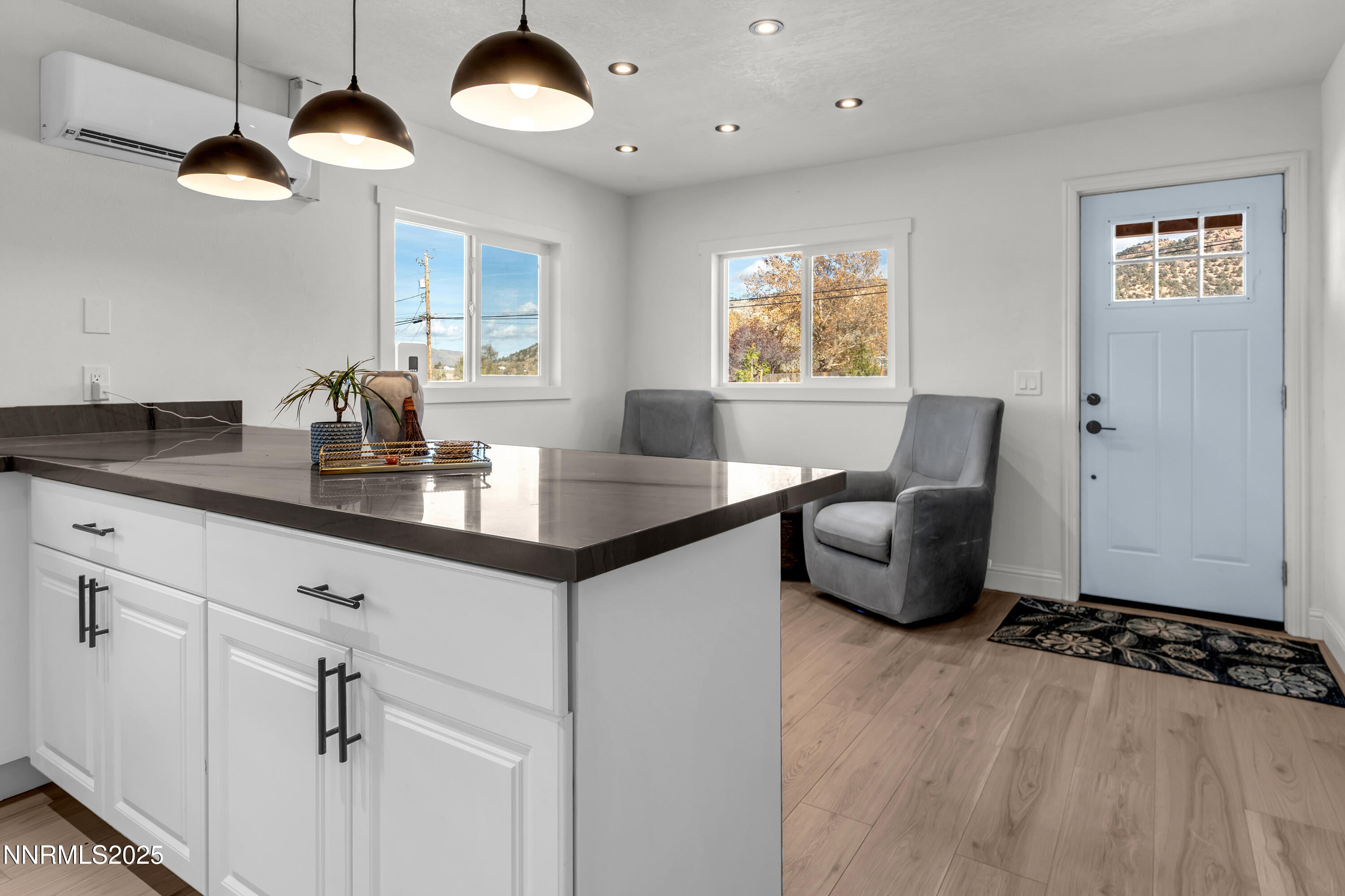 15725 Toll Road Reno, NV 89521 - Photo 13 of 27 a kitchen with a table chairs and a chandelier