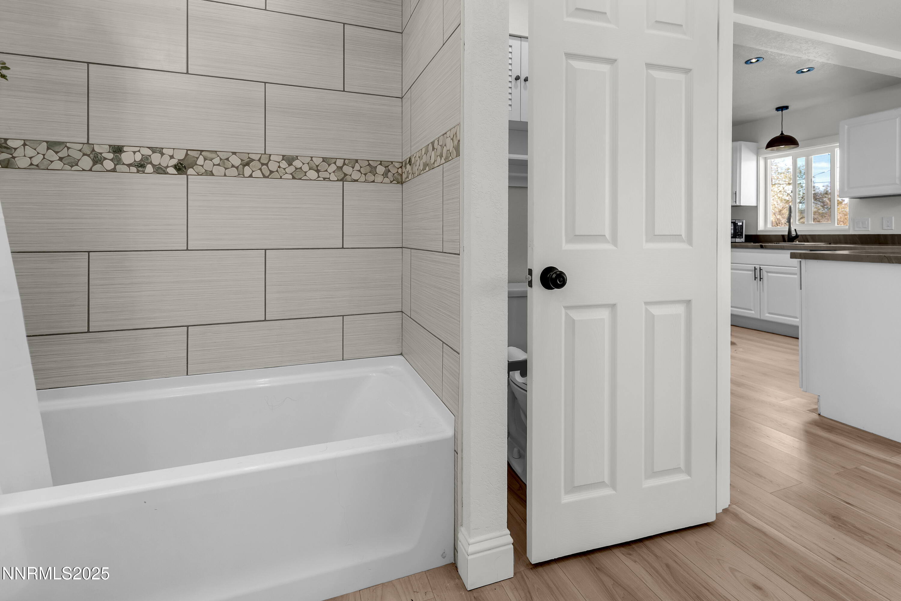 15725 Toll Road Reno, NV 89521 - Photo 23 of 27 a bathroom with a bathtub and shower