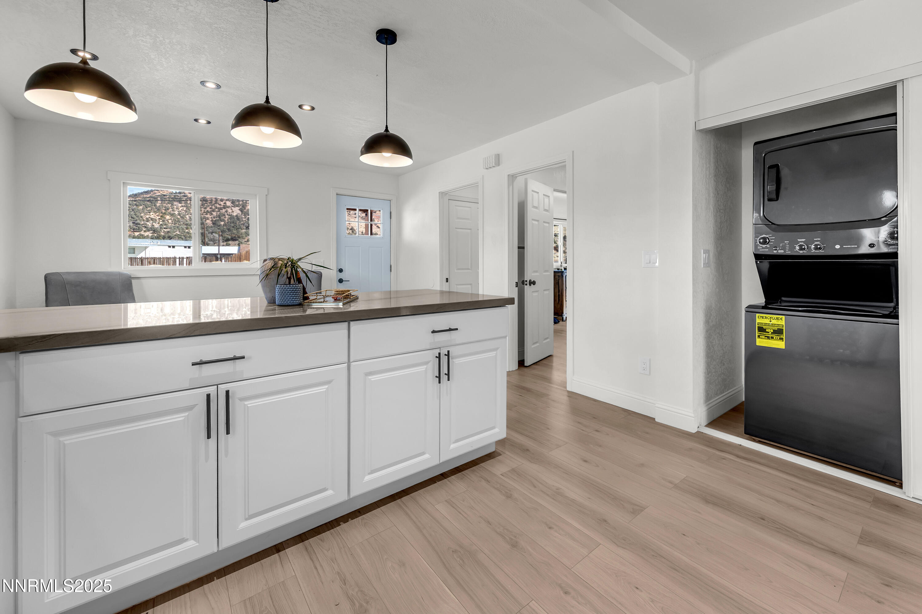 15725 Toll Road Reno, NV 89521 - Photo 9 of 27 a kitchen with a sink stainless steel appliances and cabinets