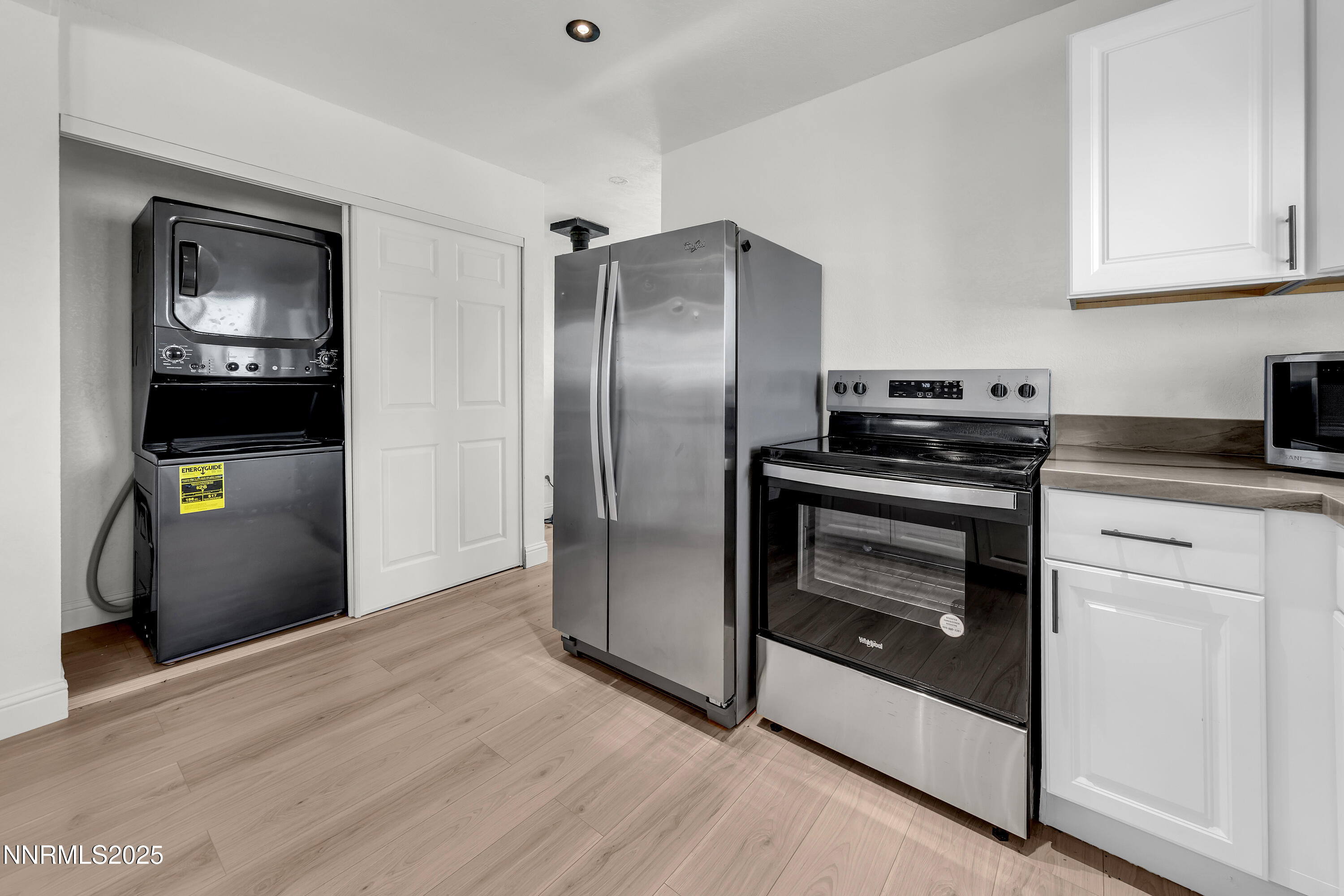 15725 Toll Road Reno, NV 89521 - Photo 10 of 27 a kitchen with cabinets and stainless steel appliances
