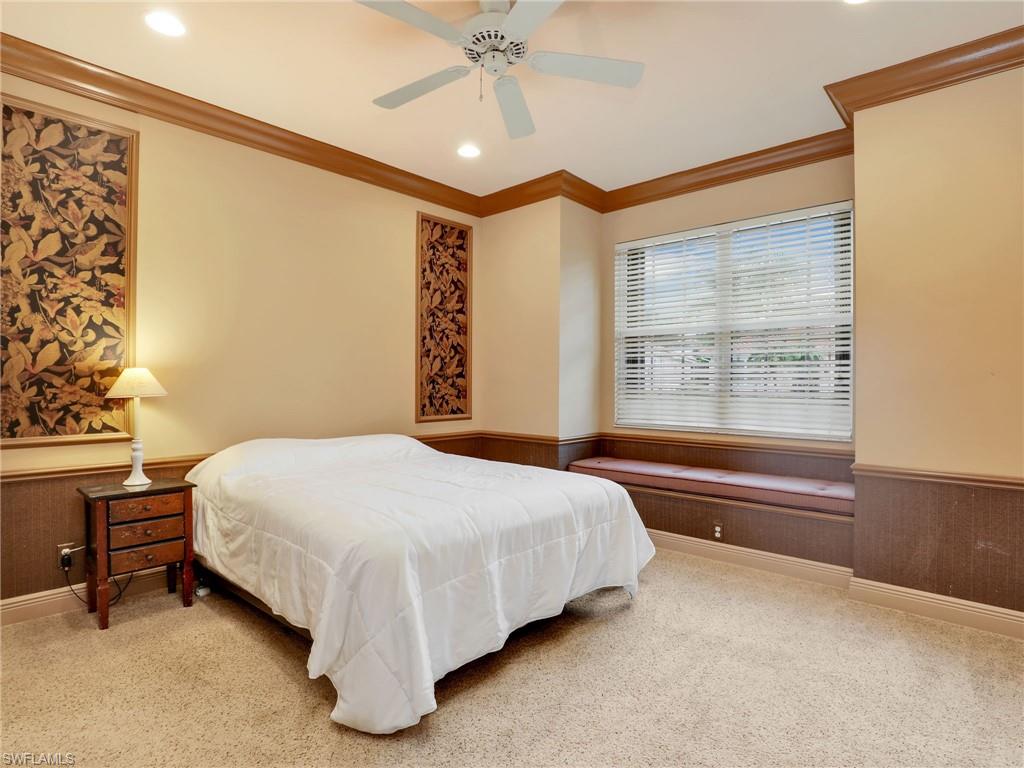 9241 Springview Loop Estero, FL 33928 - Photo 15 of 41 Carpeted bedroom featuring wainscoting, crown molding, a ceiling fan, and recessed lighting