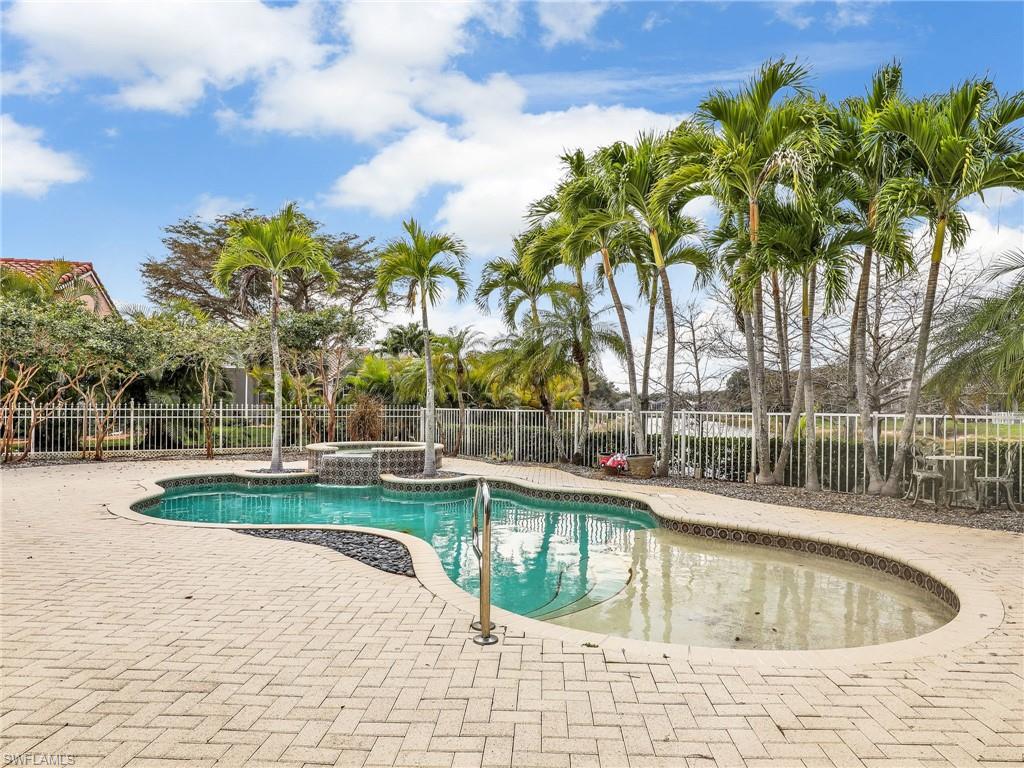 9241 Springview Loop Estero, FL 33928 - Photo 21 of 41 Integrated pool / spa with a fenced backyard and a patio