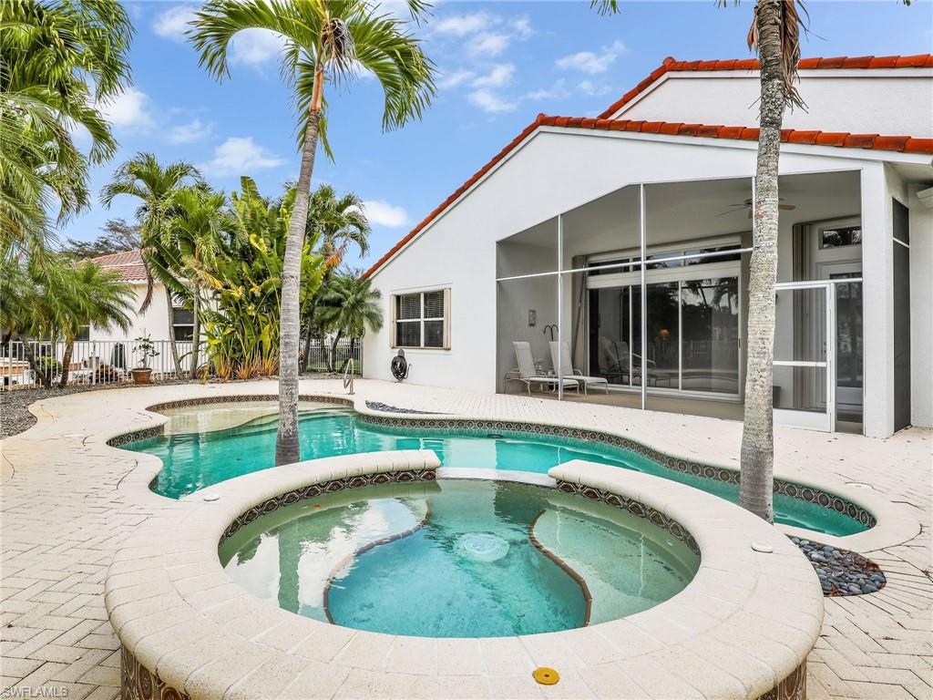 9241 Springview Loop Estero, FL 33928 - Photo 23 of 41 Relaxing pool / spa with a patio area and a sunroom