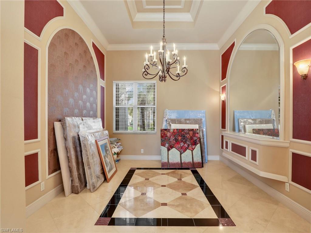 9241 Springview Loop Estero, FL 33928 - Photo 40 of 41 Sitting room with hanging lights, crown molding, and a raised ceiling