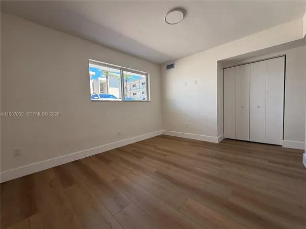 a view of living room with furniture and a large window