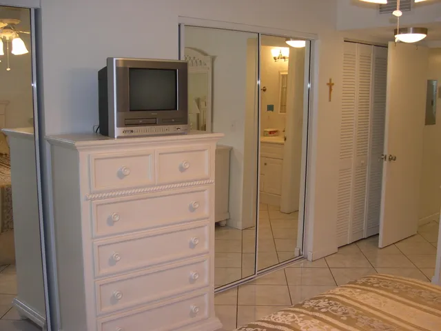 a bathroom with a shower and a mirror